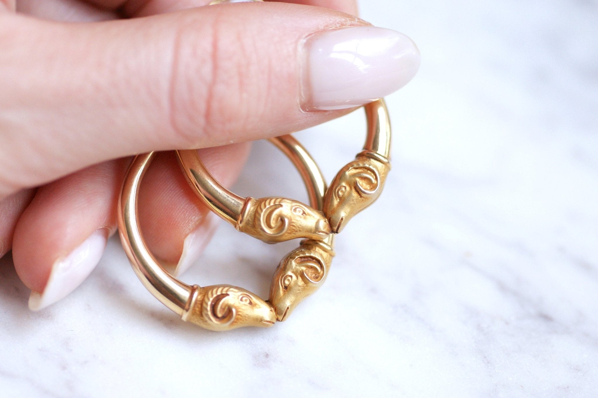 Gold ram head hoop earrings deals
