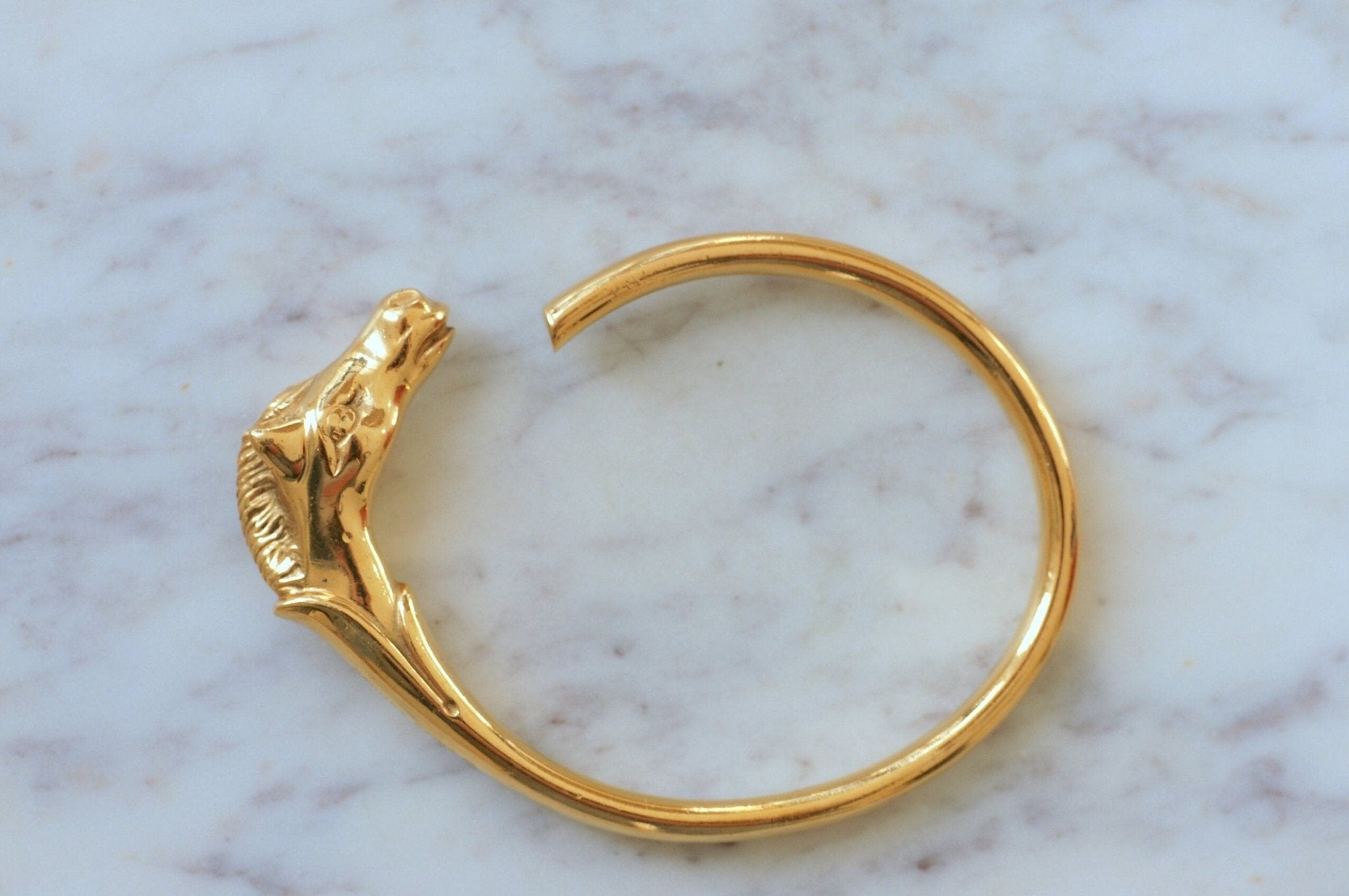 Golden Hermes horse head bracelet | Penelope Gallery