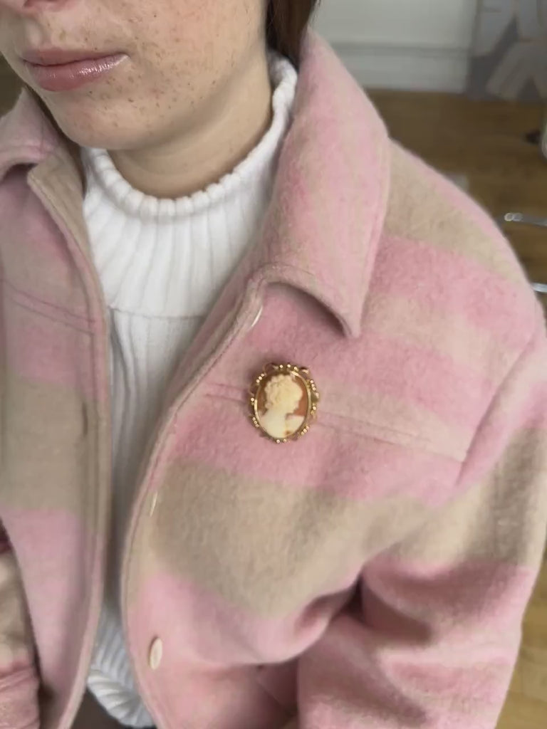 Two gold and shell cameo brooch