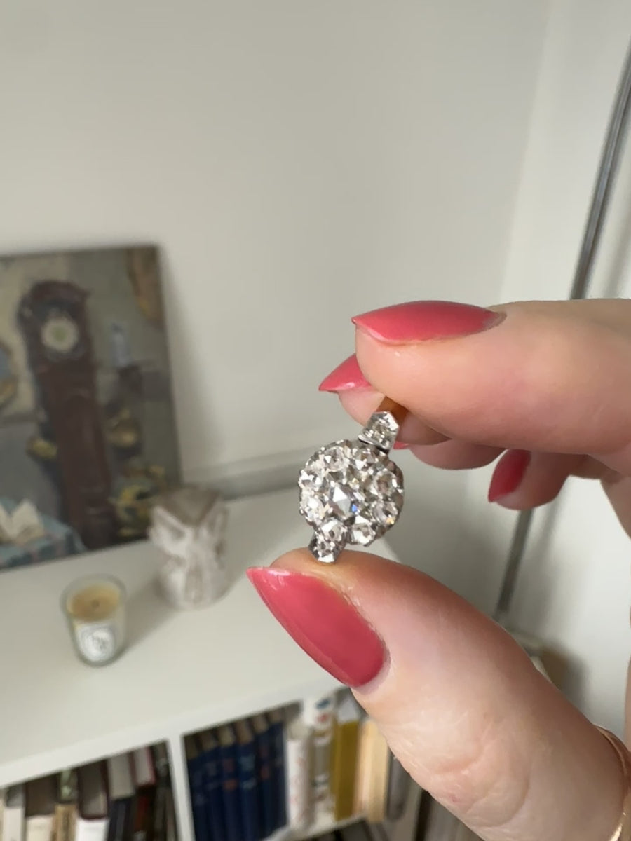 Engagement ring with daisy and diamonds