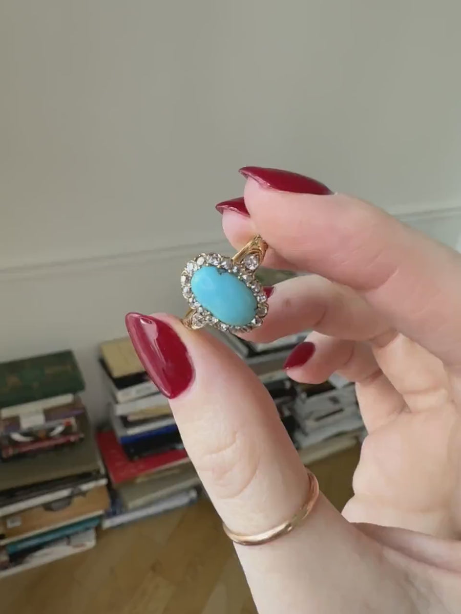 Antique Marguerite turquoise ring surrounded by diamonds