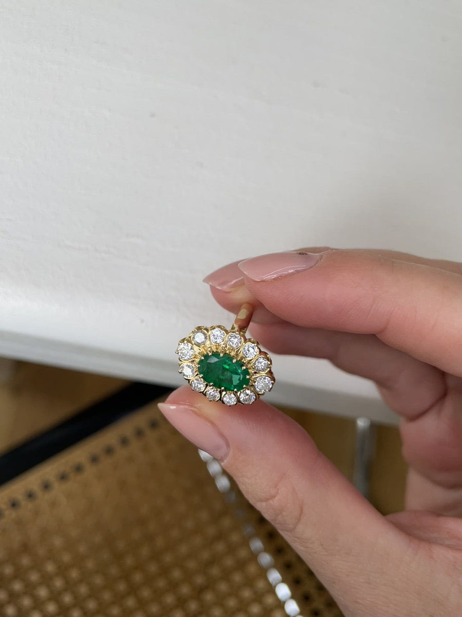 Emerald marquise ring with diamond setting