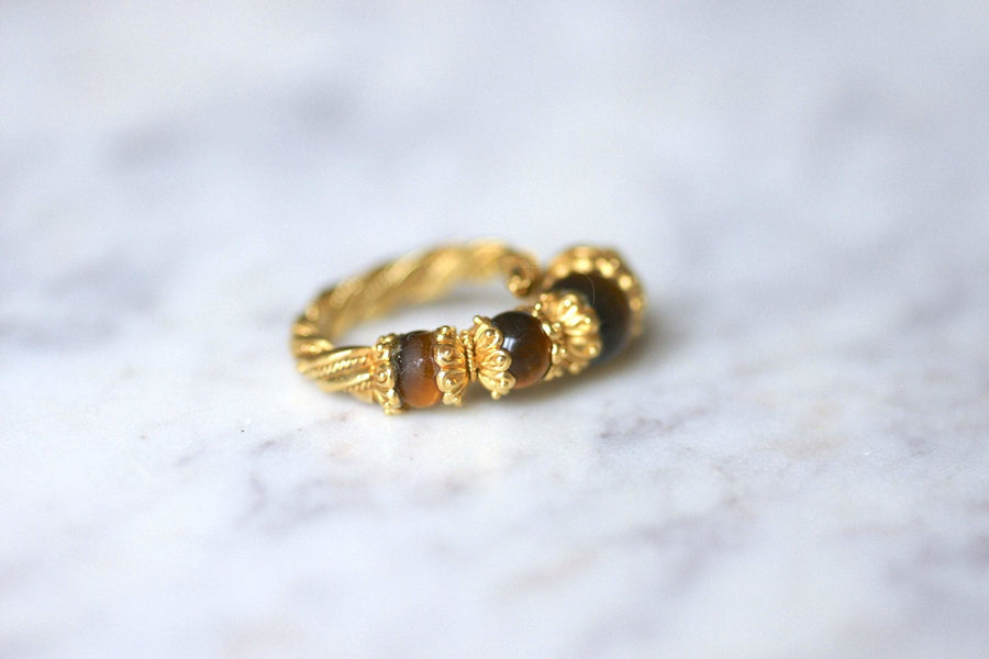 Ilias Lalaounis lion head ring in yellow gold and tiger eye quartz - Penelope Gallery