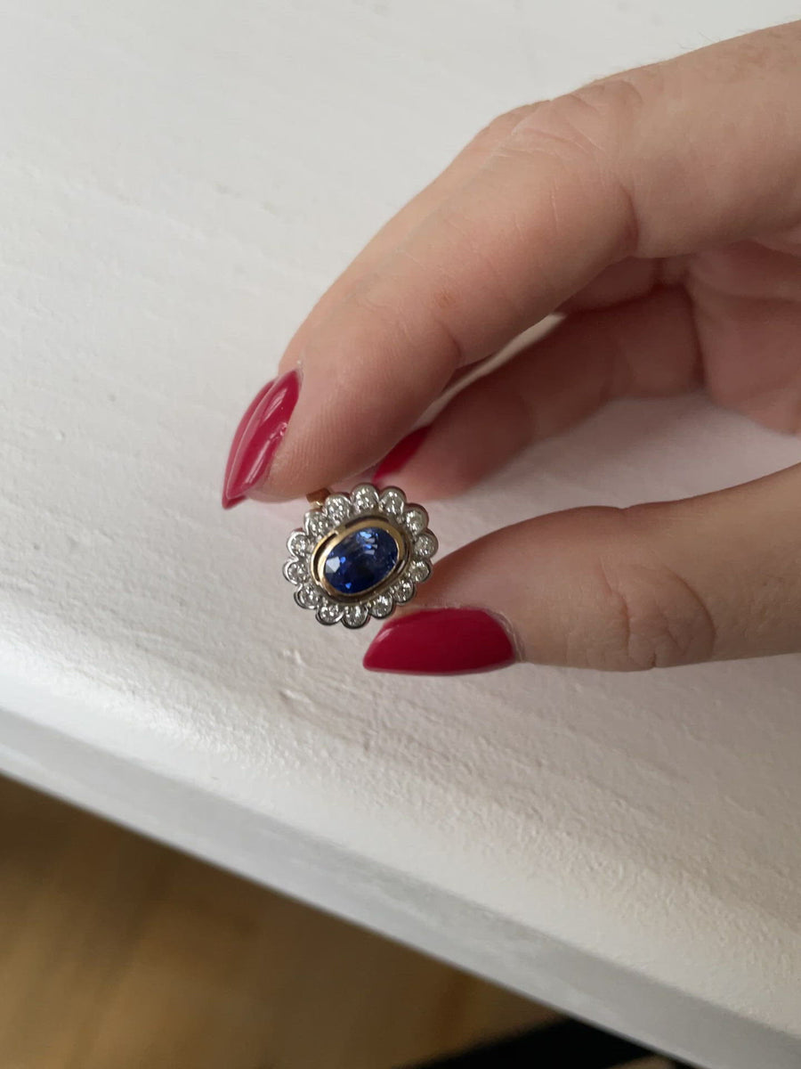 Pompadour sapphire ring surrounded by diamonds