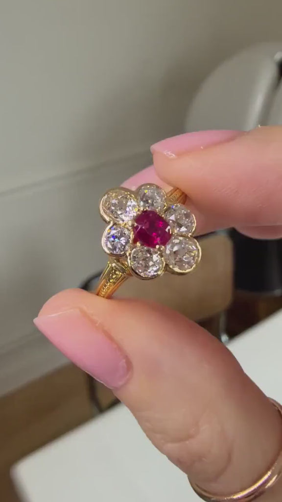 Vintage Marguerite Ring with a 0.60 Ct Burmese Ruby and Diamonds Set in Yellow Gold